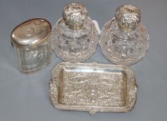 A pair of Edwardian repousse silver mounted cut glass scent bottles, Birmingham, 1905, 11.8cm, a