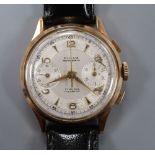 A gentleman's 1950's 18k Dulux chronograph manual wind wrist watch, on later associated strap.