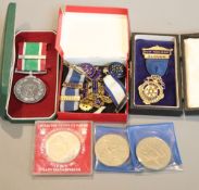 A group of medals, coins etc.