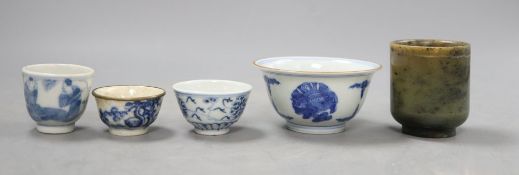 A group of Chinese cups, four ceramics, one jade and some have marks