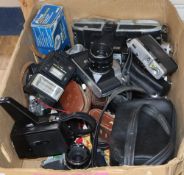 A box of various cameras and camera equipment including Zenith, Olympus, Miranda, Rank Aldis, etc.