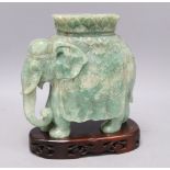 A large Chinese stone carving of elephant, with wood stand, overall 26cm