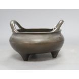 A large Chinese bronze censer with inscriptions, height 13cmCONDITION: There is a repair to the