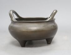 A large Chinese bronze censer with inscriptions, height 13cmCONDITION: There is a repair to the