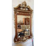 An 18th century style parcel gilt mahogany wall mirror in the manner of William Kent, W.74cm, H.