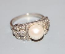 A 1960's? white metal, cultured pearl and diamond chip set dress ring, size K, gross 5.9 grams.