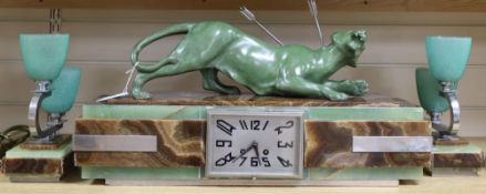 An Art Deco clock onyx and bronze 'tiger' clock garniture, length 59cm