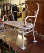 An early 20th century Thonet style caned bentwood settee (a.f), W.110cm, D.50cm, H.107cmCONDITION: