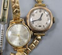 Two lady's 9ct gold cased manual wind wrist watches on gold plated straps, gross 28.9 grams.