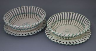 Two late 18th century Wedgwood creamware chestnut baskets and stands, length 30cm