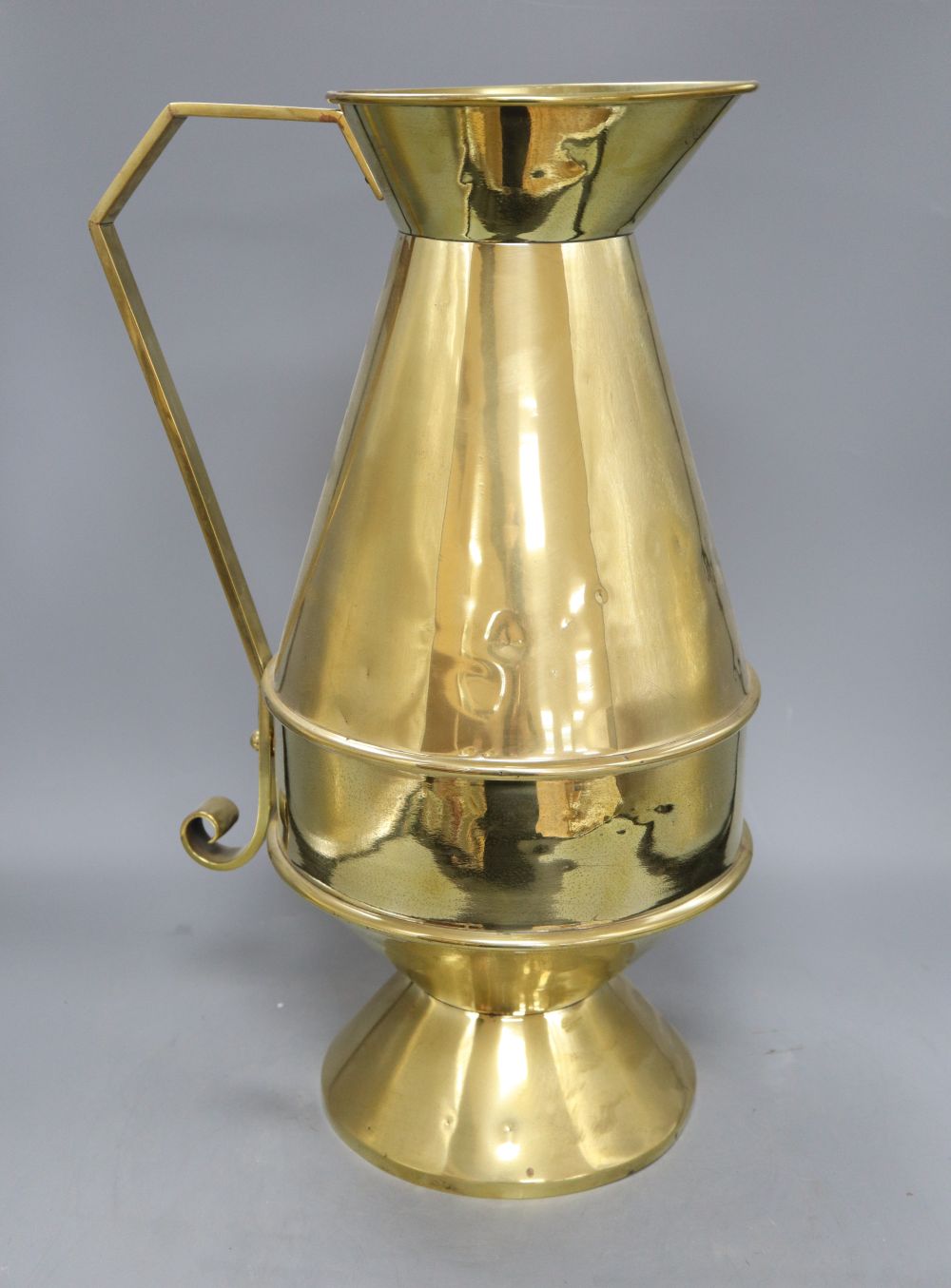 An Aesthetic movement brass communion jug, c.1870, height 49cm