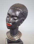 A 1960's ceramic bust of a tribal woman, signed, height 22cm