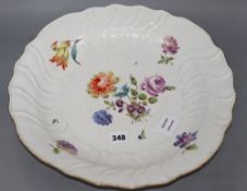 A Meissen shaped circular floral painted dish, diameter 38cmCONDITION: There is a chip to the rim,