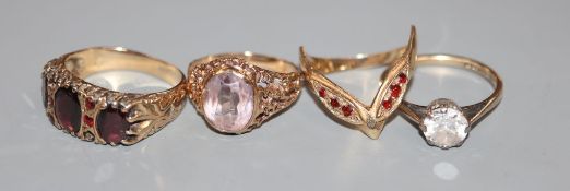 Four assorted 9ct gold and gem set dress rings including Victorian style garnet ring, gross 12.8