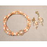 A modern, double strand cultured pearl and simulated coral bead bracelet with gilt spacers, 15cm and