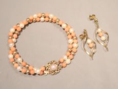 A modern, double strand cultured pearl and simulated coral bead bracelet with gilt spacers, 15cm and