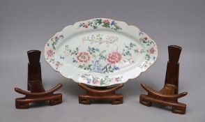 A Chinese famille rose oval dish and three hardwood stands, width 27cmCONDITION: There is general