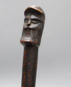 A primitive head handed walking cane, c.1840, length 92cm