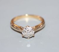 A modern 18ct gold and diamond cluster ring, size M, gross 2.6 grams.CONDITION: Tiny nick/chip to