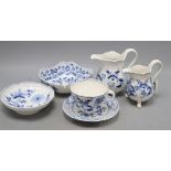 Two Meissen jugs, a cup and saucer and two dishes in blue and white onion pattern, tallest