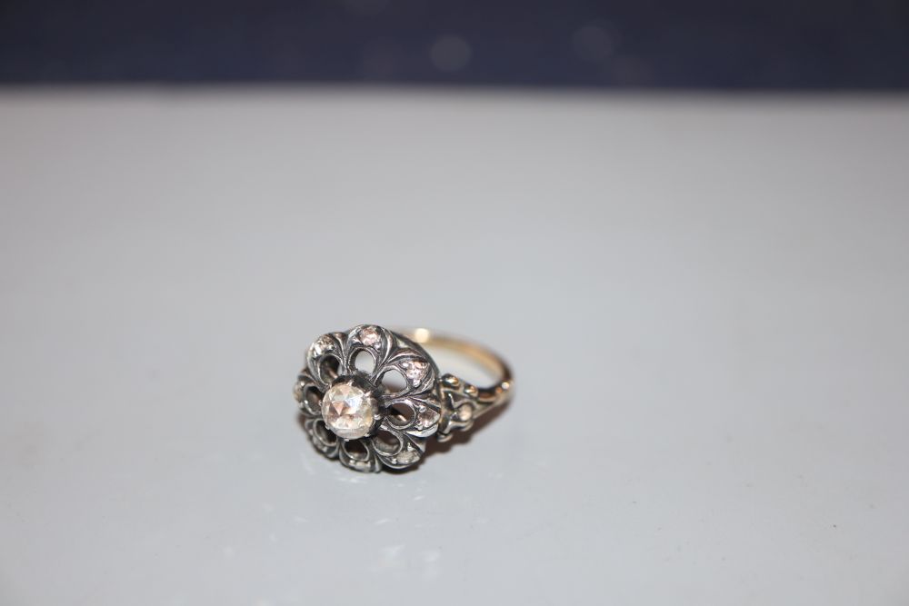 A 19th century yellow metal and diamond cluster set pierced openwork ring, size L, gross 5.6 grams. - Image 2 of 2