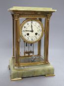 A four glass onyx and brass Corinthian columned clock, height 50cm width 19cm