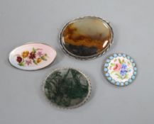 Two white metal mounted moss agate brooches, largest 51mm and two other enameled items including