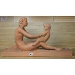 A French Art Deco terracotta figure of a mother and child, signed Ugo Cipriani (1887-1960), length