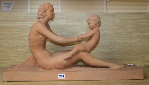 A French Art Deco terracotta figure of a mother and child, signed Ugo Cipriani (1887-1960), length