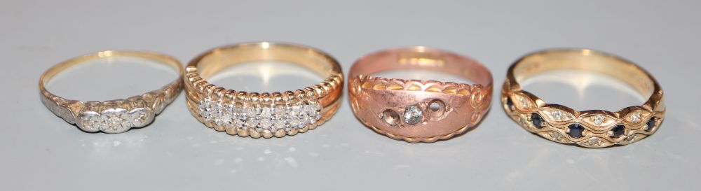 Three assorted 9ct gold and gem set dress rings( stones missing), gross 7.9 grams and an 18ct and