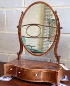 A George III mahogany and boxwood strung swing-frame toilet mirror, W.43cm, D.21cm, H.56cmCONDITION: