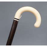 An ivory handled walking cane, c.1920, length 90cm