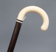 An ivory handled walking cane, c.1920, length 90cm