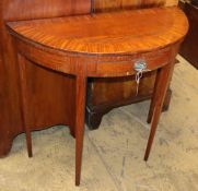A George III satinwood oval folding card table, W.86cm, D.38cm, H.79cmCONDITION: The top has a