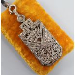 A 1930's Art Deco French white metal and marcasite set lorgnettes pendant, on a fabric necklace,