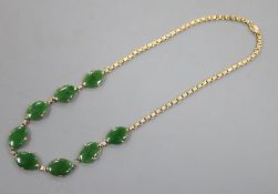 A mid 20th century Chinese 18k yellow metal and oval jade set necklace, (a.f.), length 38cm, gross