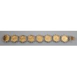 A 9ct mounted gold half sovereign bracelet, set with eight half sovereigns, gross weight 53.5