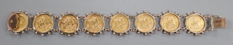 A 9ct mounted gold half sovereign bracelet, set with eight half sovereigns, gross weight 53.5