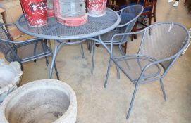 A mesh metal circular garden table and four chairs, table 110cm diameter