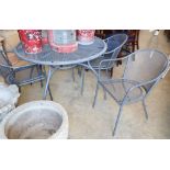 A mesh metal circular garden table and four chairs, table 110cm diameter