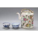 A Chinese famille rose teapot, height 15cm and two blue and white teabowlsCONDITION: Smaller of