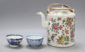 A Chinese famille rose teapot, height 15cm and two blue and white teabowlsCONDITION: Smaller of