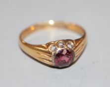 A Victorian 18ct gold and claw set solitaire garnet ring, size Q/R, gross 3.1 grams.CONDITION: