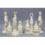 Two 19th century pearlware cruets and a pair of candlesticks, tallest 25cm