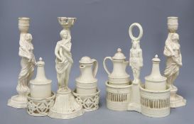 Two 19th century pearlware cruets and a pair of candlesticks, tallest 25cm