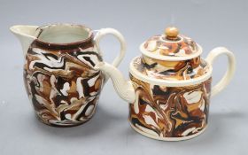 A late 18th century agate ware teapot and cover and a similar 19th century jug, tallest 13cm