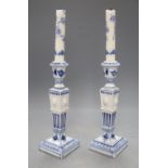 A pair of Royal Copenhagen blue and white candlesticks, height 23cmCONDITION: Both have plaster area