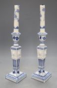 A pair of Royal Copenhagen blue and white candlesticks, height 23cmCONDITION: Both have plaster area