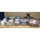 A group of Japanese Imari dishes and bowls, and a St Ives pottery vase