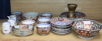 A group of Japanese Imari dishes and bowls, and a St Ives pottery vase